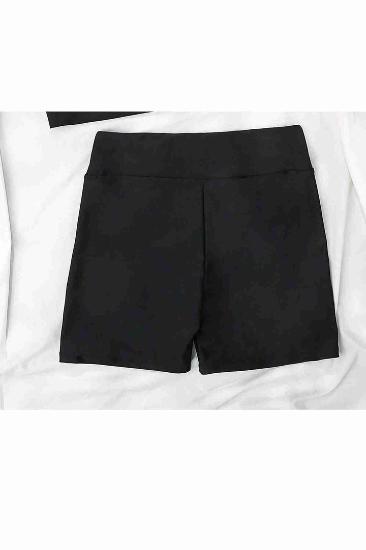 IGR Women Angels in Stylish Black Shorts by the Sea - Uden